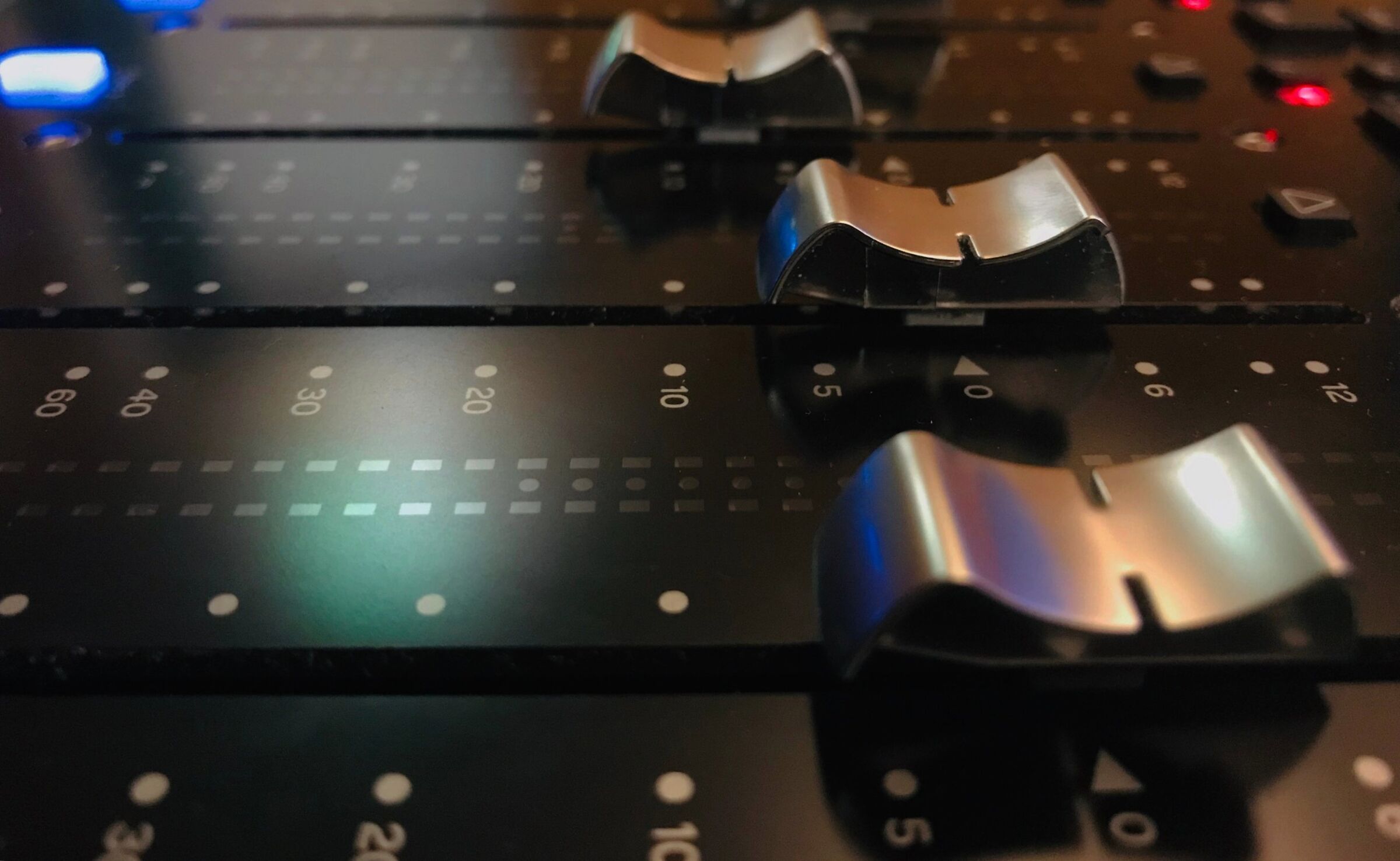 Faders on a mixing console